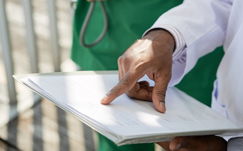 Medical Cost Projection - Clinicians pointing at information - E Wills Legal Nurse Consultants