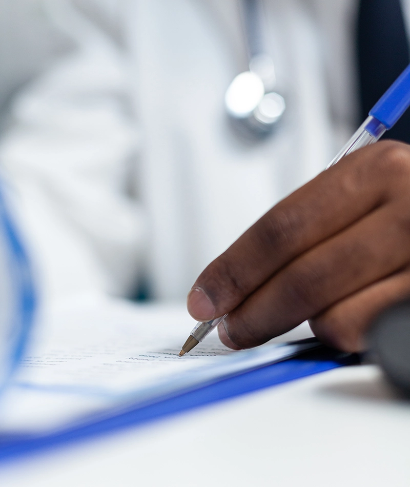 Medical Cost Projection - Physician reviewing medical files - E Wills Legal Nurse Consultants